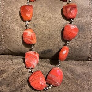 Red and white chunky stone ( not sure if stone, coral or glass )